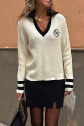 Suéter de moda con cuello en V beige de Quebec